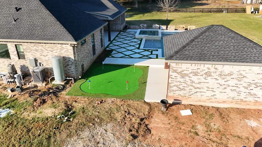 Completed turf and paver outdoor living transformation